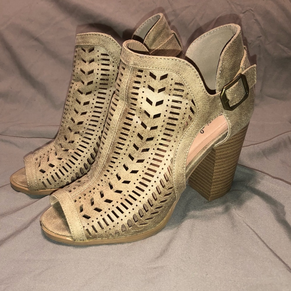 Peep toe suede booties with cut outs and buckles